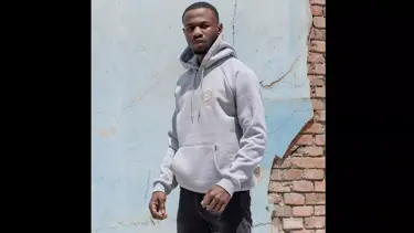 Model wearing grey hoodie