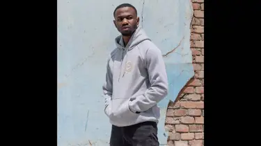 Model wearing grey hoodie