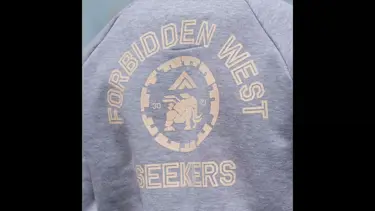 The back of a grey hoodie. Text reads: Forbidden West Seekers