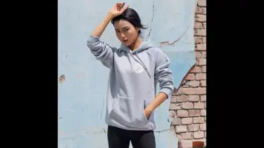 Model wearing grey hoodie